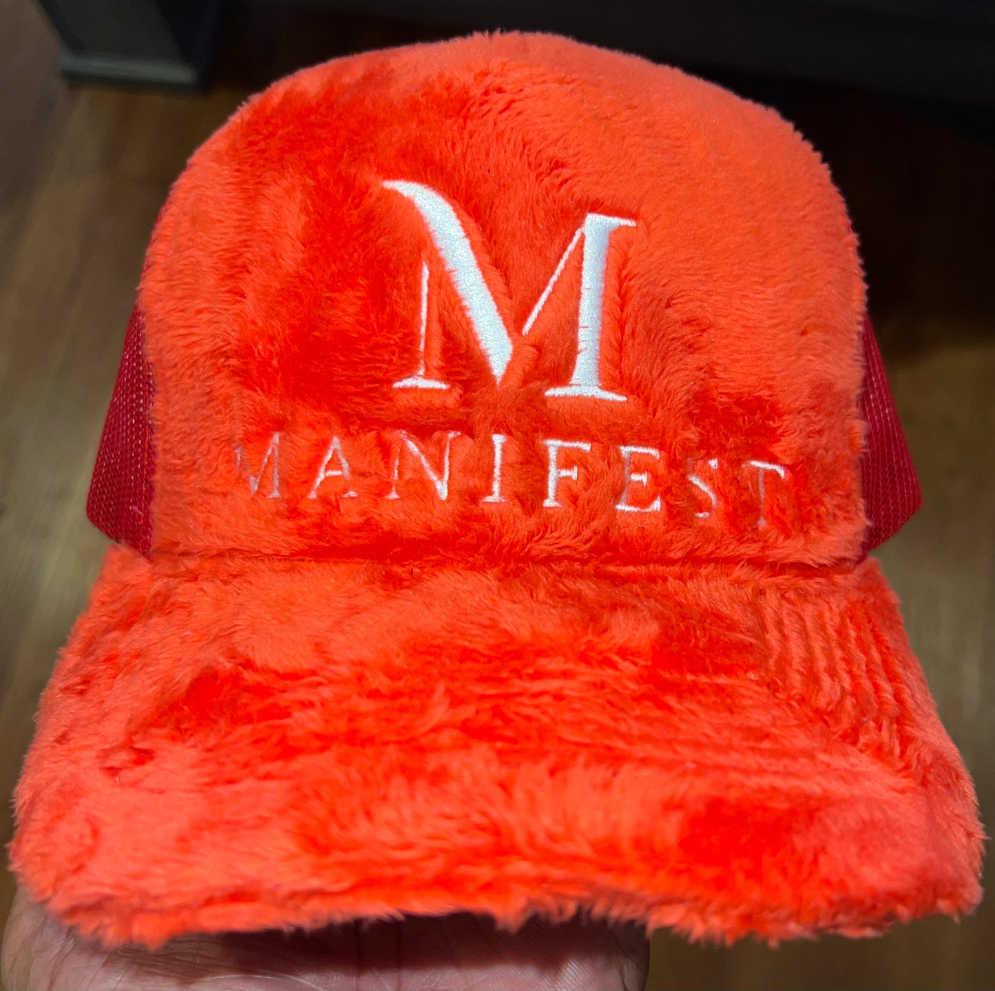 RED FUZZY VALVET MANIFEST TRUCKER HAT